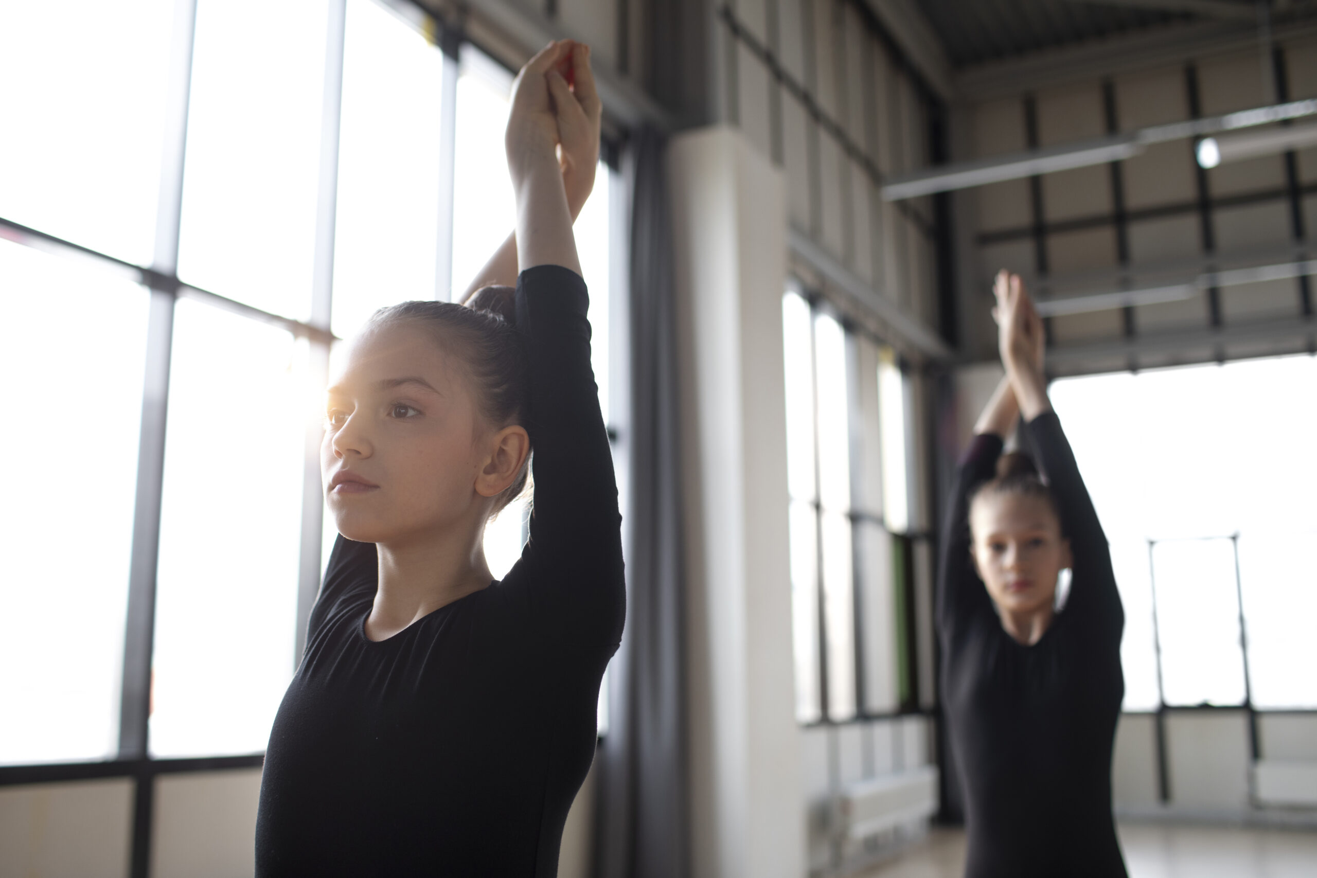 young-girls-training-together-gymnastics